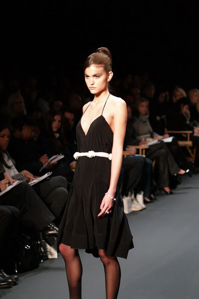 Model walking a darkened runway